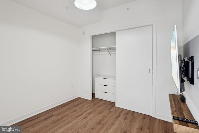 2030 8th St NW Unit Ph-5, Washington, DC 20001 - unfurnished bedroom with wood finished floors, a closet, and baseboards