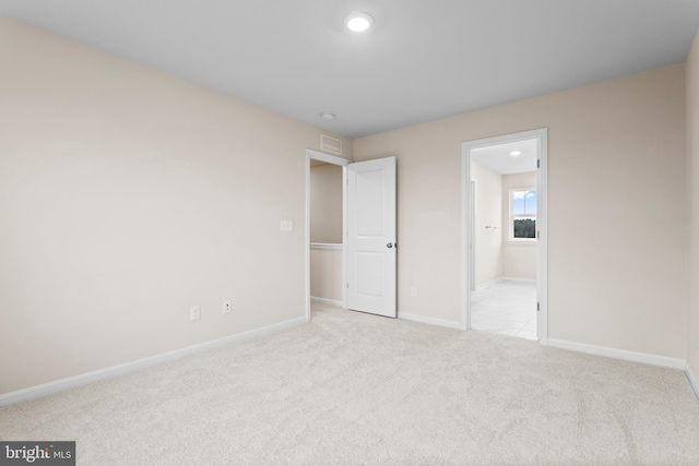 unfurnished bedroom with baseboards, recessed lighting, and carpet