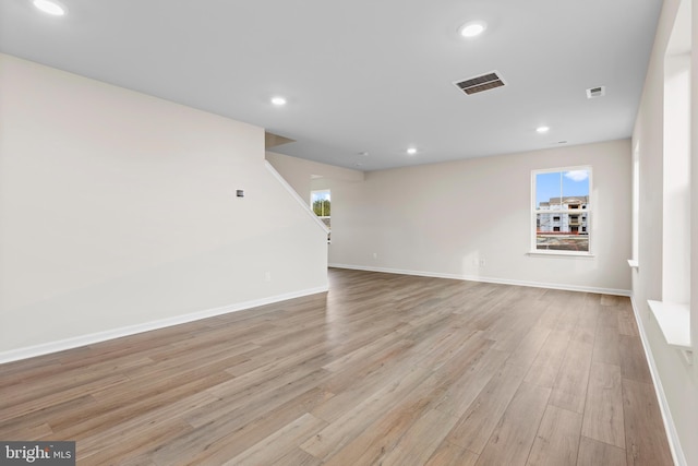 interior space with light wood-style floors, baseboards, recessed lighting, and visible vents