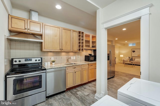 7312 Gordons Rd, Falls Church, VA 22043 - kitchen featuring appliances with stainless steel finishes, a sink, light wood-type flooring, under cabinet range hood, and light brown cabinetry