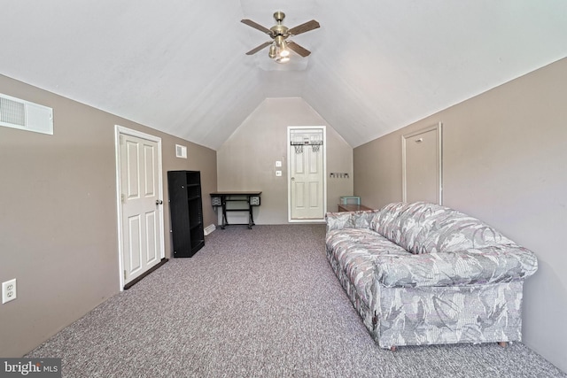 carpeted living room with a ceiling fan, visible vents, and lofted ceiling
