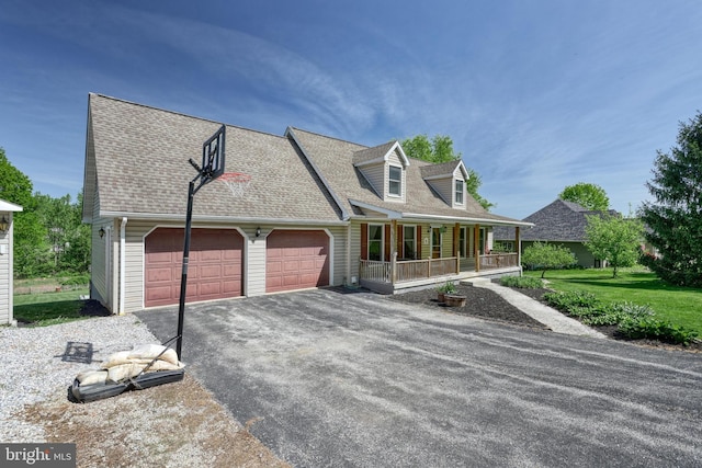 cape cod home featuring a porch, aphalt driveway, roof with shingles, and a garage