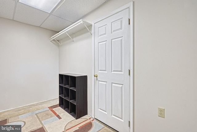 walk in closet featuring a drop ceiling