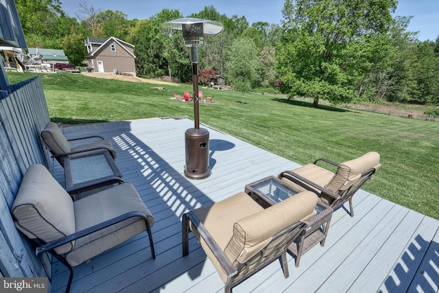 deck featuring a lawn