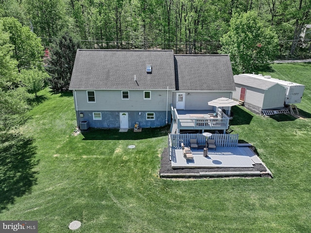 drone / aerial view featuring a forest view