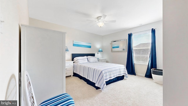 bedroom with baseboards, a ceiling fan, and carpet floors