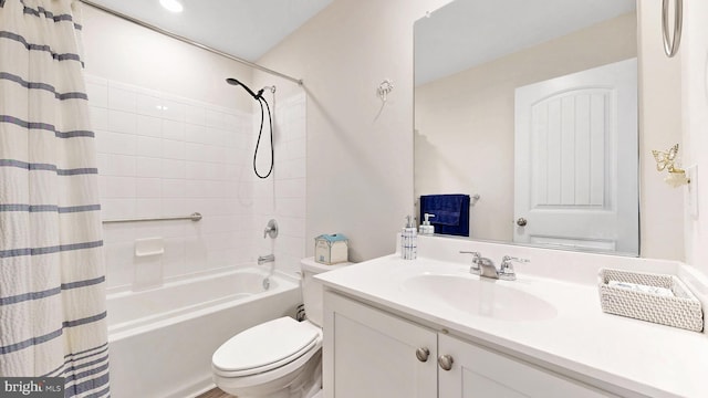 full bathroom with vanity, toilet, and shower / bath combo