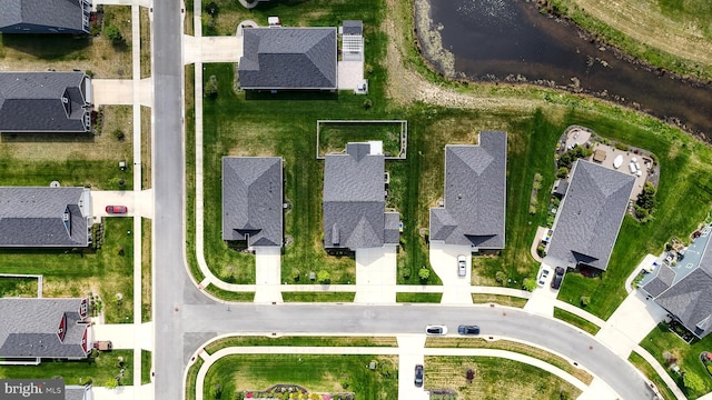 aerial view featuring a water view and a residential view