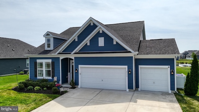 view of front of house featuring concrete driveway, an attached garage, a shingled roof, and a front yard