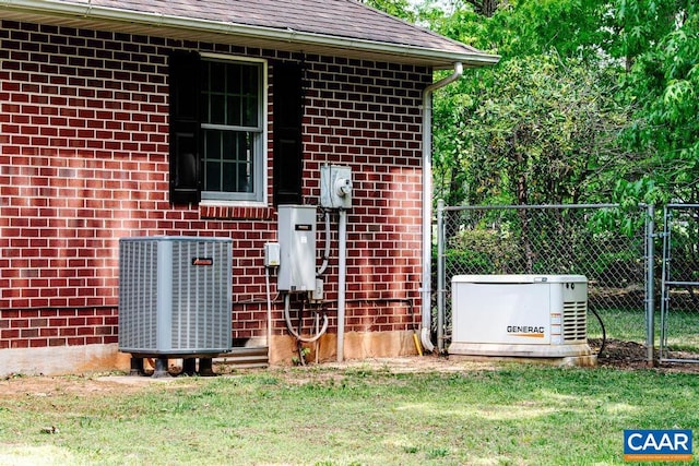 exterior space featuring central air condition unit and fence