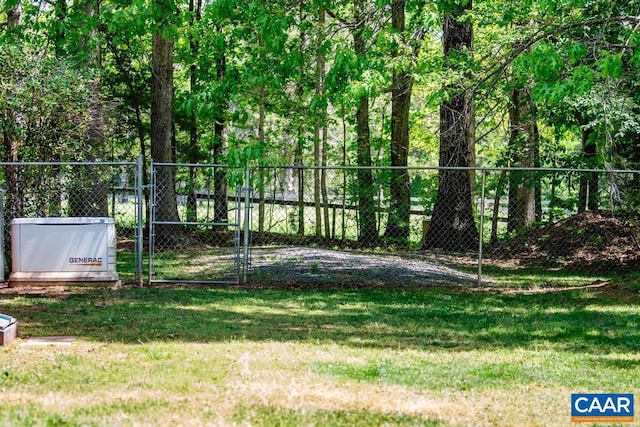 view of yard featuring a gate and fence