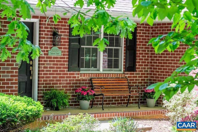 exterior space with brick siding