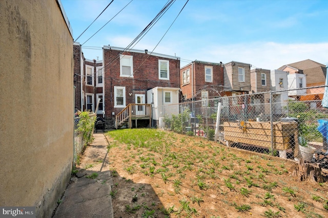 view of yard featuring fence and a residential view