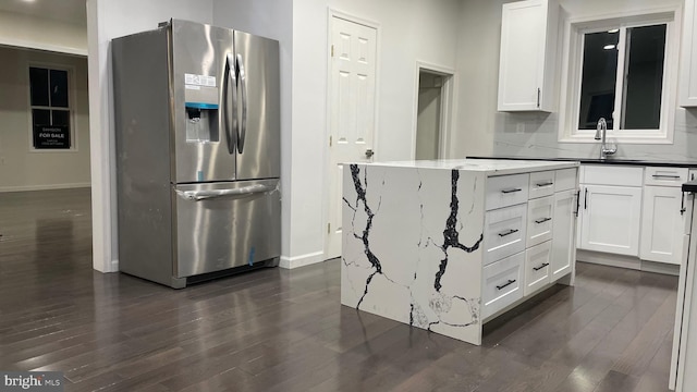 123 Cumberland St, Cumberland, MD 21502 - kitchen featuring dark wood-style flooring, stainless steel refrigerator with ice dispenser, baseboards, and a sink
