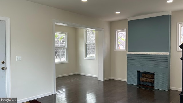 123 Cumberland St, Cumberland, MD 21502 - unfurnished living room with dark wood-style flooring, recessed lighting, and plenty of natural light