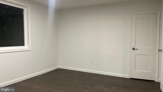 123 Cumberland St, Cumberland, MD 21502 - unfurnished room featuring baseboards and dark wood-type flooring