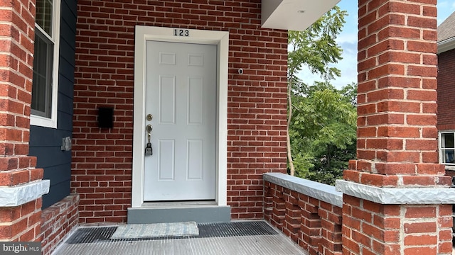 123 Cumberland St, Cumberland, MD 21502 - doorway to property with brick siding