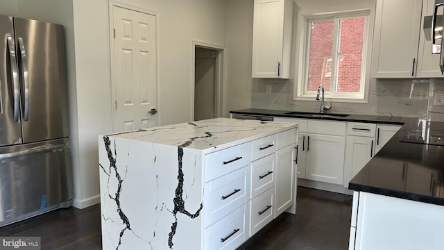 123 Cumberland St, Cumberland, MD 21502 - kitchen with a sink, tasteful backsplash, freestanding refrigerator, and dark wood finished floors