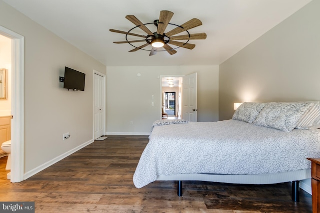bedroom featuring connected bathroom, a ceiling fan, baseboards, and dark wood-style floors