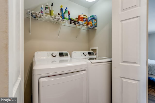 washroom featuring laundry area and independent washer and dryer
