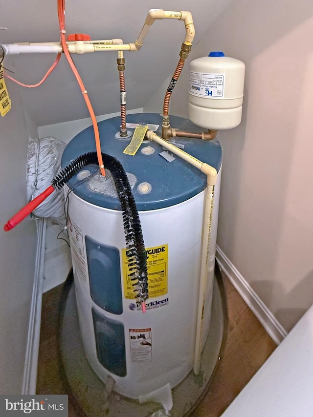 utility room with electric water heater