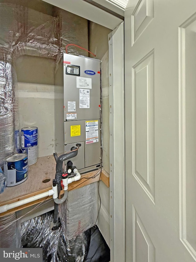 utility room featuring heating unit