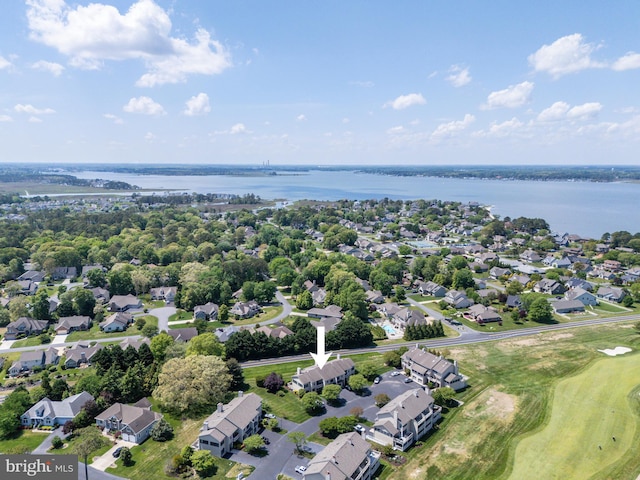 aerial view with a water view, golf course view, and a residential view