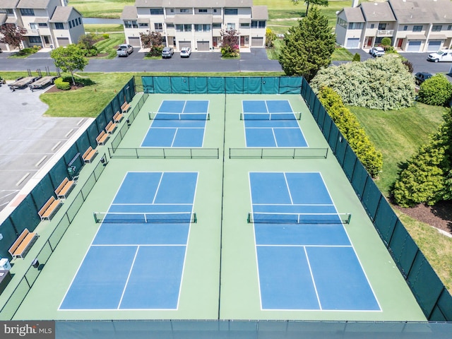 view of sport court with fence