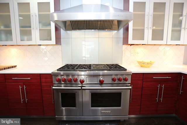 2129 E Lombard St, Baltimore, MD 21231 - kitchen featuring exhaust hood, double oven range, light countertops, modern cabinets, and backsplash