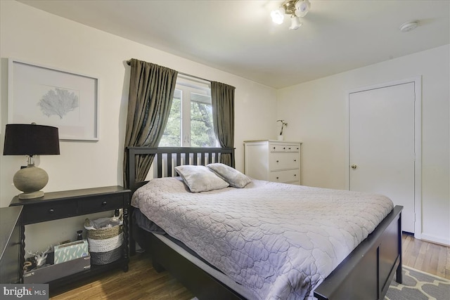 bedroom with wood finished floors