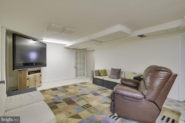 living room featuring baseboards, carpet, and visible vents
