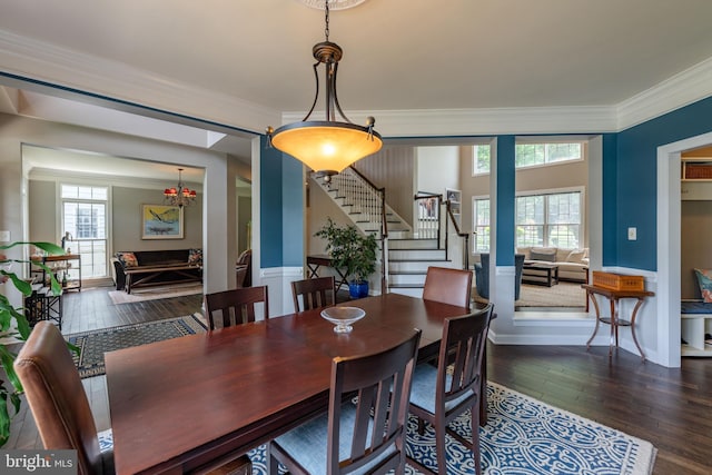 712 Pearson Point Pl, Annapolis, MD 21401 - dining area featuring stairway, ornamental molding, healthy amount of natural light, hardwood / wood-style flooring, and a chandelier