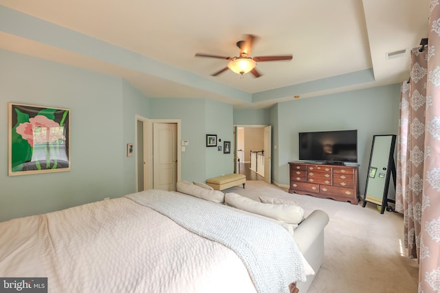 712 Pearson Point Pl, Annapolis, MD 21401 - carpeted bedroom featuring a tray ceiling and ceiling fan