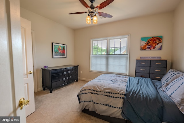 712 Pearson Point Pl, Annapolis, MD 21401 - bedroom featuring light colored carpet, baseboards, and a ceiling fan