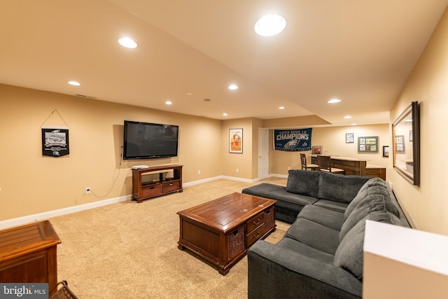 712 Pearson Point Pl, Annapolis, MD 21401 - living area with bar with sink, recessed lighting, light carpet, and baseboards