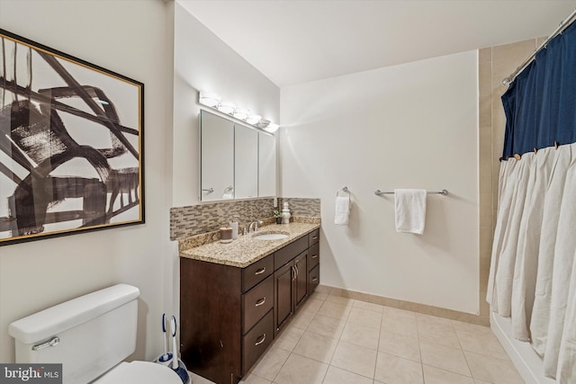 1600 Arch St Unit 1706, Philadelphia, PA 19103 - full bathroom featuring toilet, curtained shower, tile patterned flooring, tasteful backsplash, and vanity