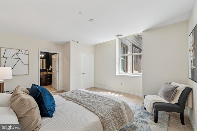 1600 Arch St Unit 1706, Philadelphia, PA 19103 - bedroom featuring light colored carpet, connected bathroom, visible vents, and baseboards