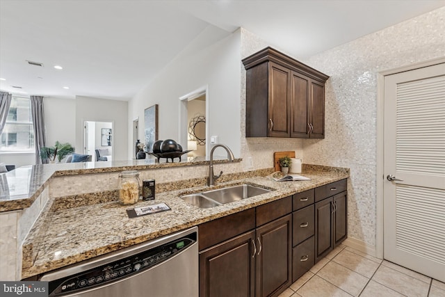 1600 Arch St Unit 1706, Philadelphia, PA 19103 - kitchen with light stone counters, light tile patterned flooring, a sink, and dishwasher