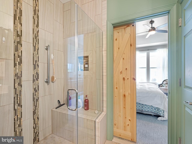 bathroom featuring ensuite bathroom, a ceiling fan, and a stall shower