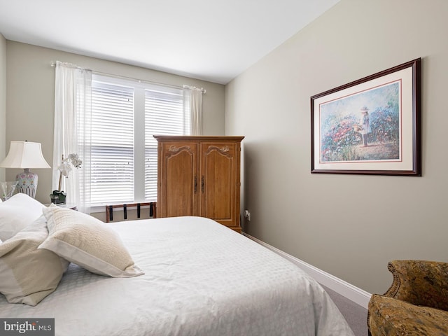 carpeted bedroom with baseboards