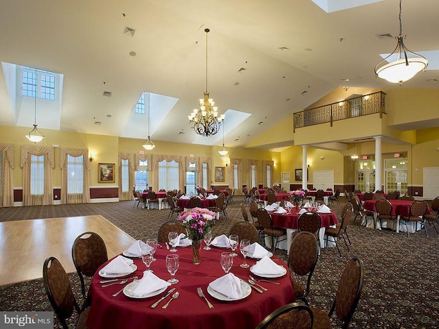 dining area featuring high vaulted ceiling, plenty of natural light, carpet floors, and visible vents