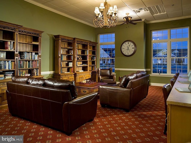 sitting room featuring carpet floors, ornamental molding, ceiling fan with notable chandelier, and visible vents