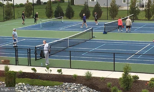 view of sport court featuring community basketball court and fence