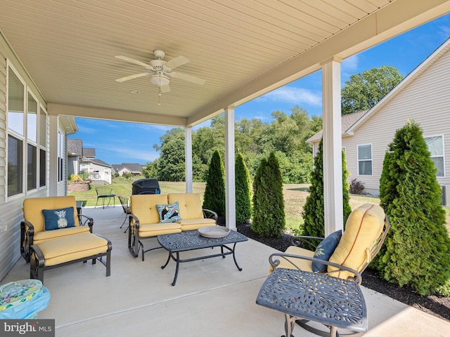view of patio / terrace with an outdoor living space and a ceiling fan