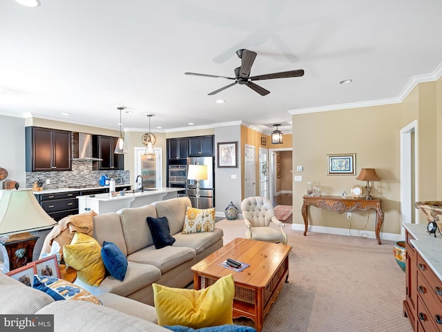 living room with a ceiling fan, light colored carpet, baseboards, ornamental molding, and recessed lighting
