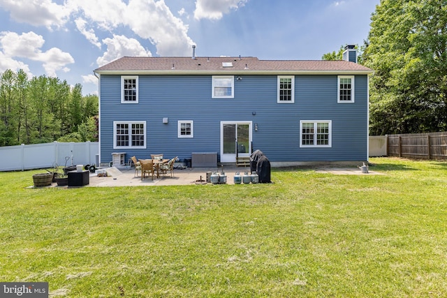 4 Honeysuckle Dr, Robbinsville, NJ 08691 - back of house with a chimney and a patio
