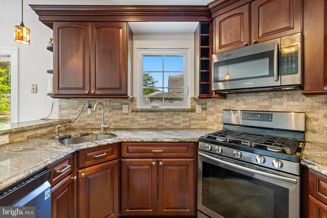 4 Honeysuckle Dr, Robbinsville, NJ 08691 - kitchen featuring appliances with stainless steel finishes, a sink, plenty of natural light, and light stone counters