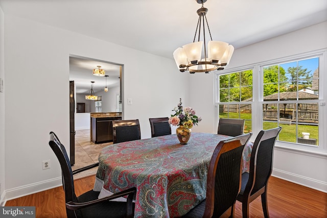 4 Honeysuckle Dr, Robbinsville, NJ 08691 - dining space with a chandelier, healthy amount of natural light, and baseboards