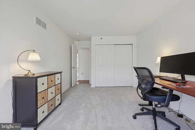 carpeted office featuring baseboards and visible vents