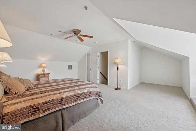 bedroom with visible vents, carpet flooring, ceiling fan, and lofted ceiling